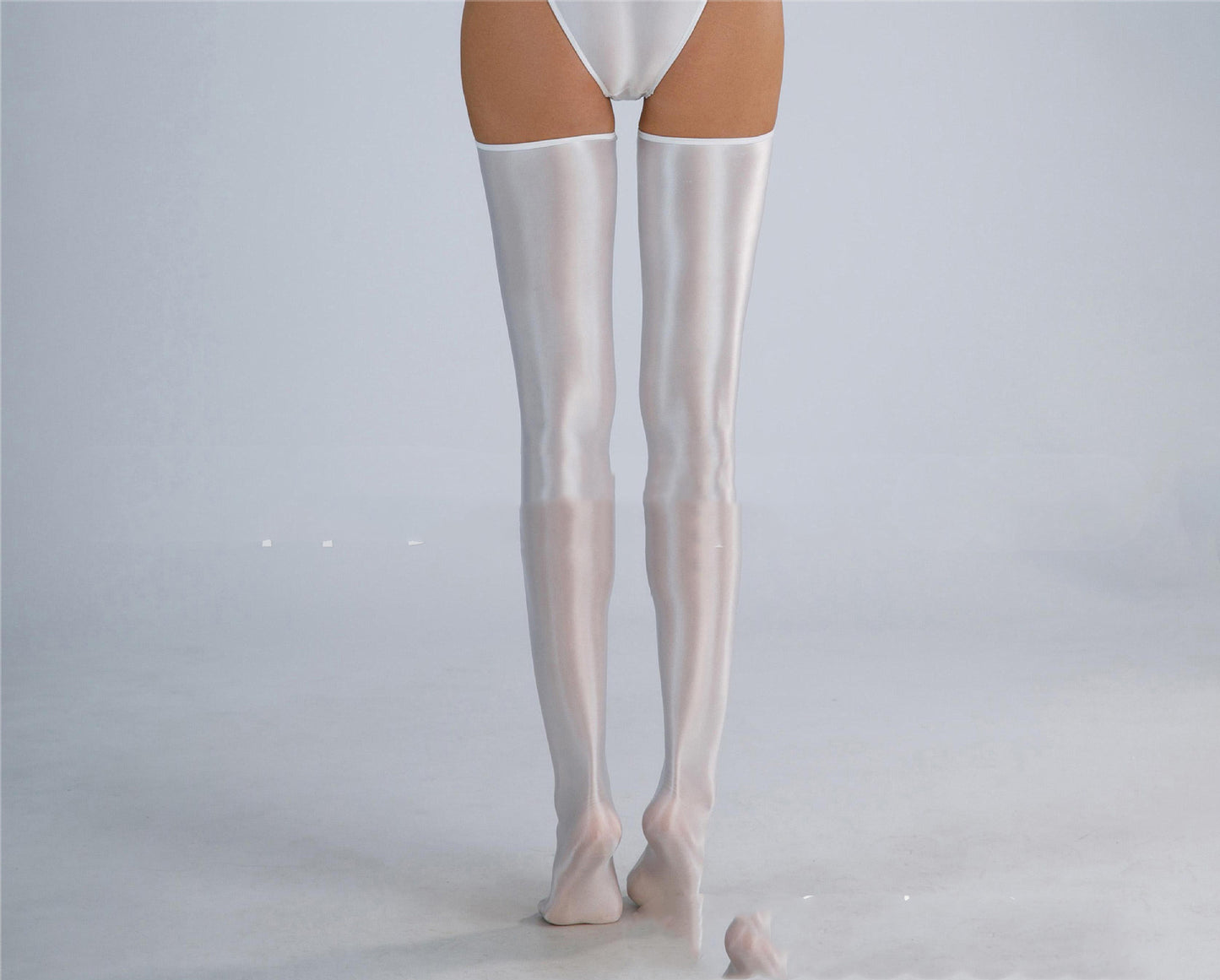 Experience the luxury and comfort of our Shiny Silky High Elastic Stockings!